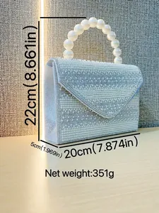 Silver evening clutch bag with full rhinestone embellishments and elegant pearl handle