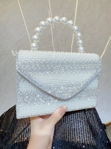 Elegant white rhinestone evening clutch bag with large pearl handle for formal parties