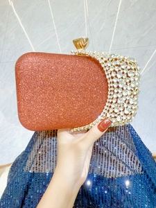 Elegant orange rhinestone clutch bag with gold metal clasp for weddings and evening parties