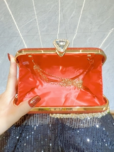 Sparkling red evening clutch bag with crystal clasp and detachable gold chain strap