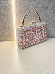 Luxury pink crystal evening handbag with sparkling rhinestones and gold handle