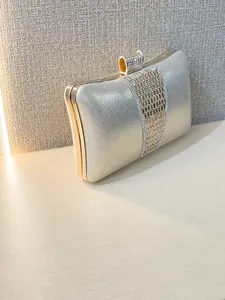 Elegant silver clutch bag with sparkling rhinestone vertical stripes for formal parties
