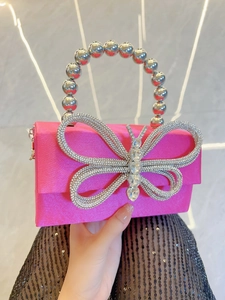 Hot pink silk square evening clutch with rhinestone bow and pearl beaded handle
