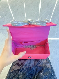 Magenta silk evening clutch box bag with a crystal bow and silver chain strap