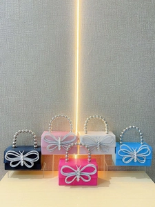 Silk evening clutch bag with crystal butterfly buckle and pearl handle in five vibrant colors
