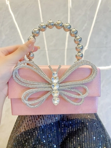 Pink satin evening clutch with large crystal butterfly and silver beaded handle detail