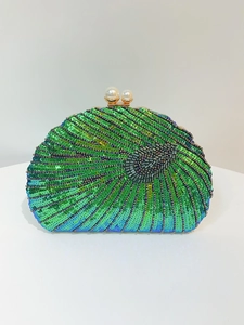 Detailed view of emerald green gradient sequins and beads on shell-shaped clutch