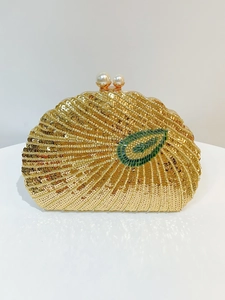 Detail of vintage beaded evening bag with golden sequins and pearl clasp