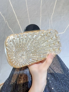 Elegant champagne gold evening clutch bag with sparkling diamond fan pattern detail