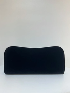 Front view of a minimalist black velvet evening clutch bag with elegant curved top edge