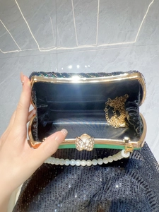 Green sequin evening clutch bag with butterfly crystal buckle and pearl handle strap