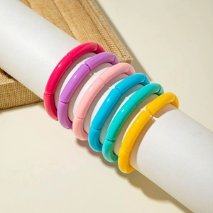 Set of six colorful acrylic bamboo-style elastic bracelets in vibrant summer hues