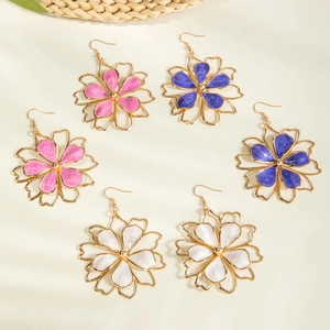 Three pairs of floral drop earrings in pink purple and white enamel with gold frames