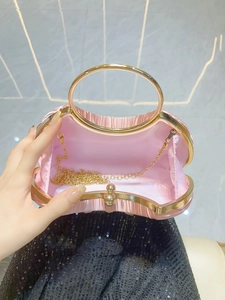 Pink satin evening tote with golden round metal handles and detachable chain strap