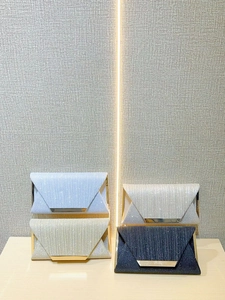 Sparkling envelope clutch bags in blue gold silver and black with gold metal trim