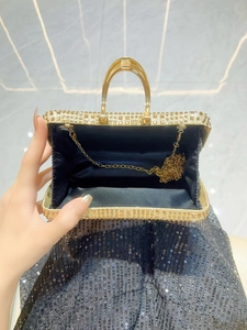 Golden rhinestone evening clutch with crystal inlay, metal handle and chain strap