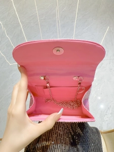 Pink rhinestone evening clutch bag with satin lining and silver metal chain strap