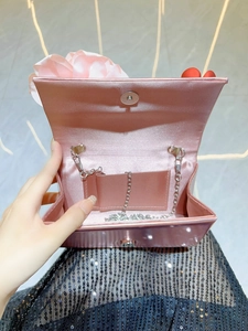Elegant pink satin flower clutch bag with silver chain strap and magnetic closure