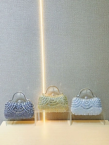 Three elegant rhinestone evening clutch bags with scallop design for weddings and parties