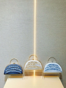 Three elegant semi-circular evening clutch bags in pearl satin with resin decoration
