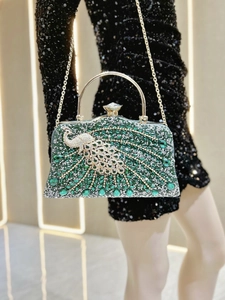 Detail of luxury evening clutch featuring green peacock motif and rhinestone inlay