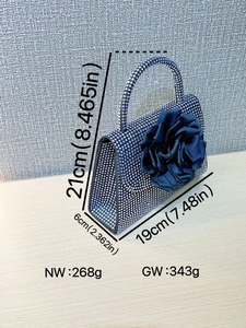 Sparkling crystal evening bag with black 3D flower detail and rhinestone top handle