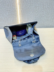 Detail of flower evening bag interior showing spacious capacity for lipstick and perfume