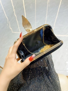 Elegant black velvet evening clutch bag with golden leaf buckle and fine chain strap