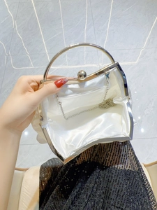Silver satin evening clutch bag with round metal handles and open interior view