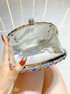 Sparkling silver evening clutch bag with colorful rhinestones and crystal clasp