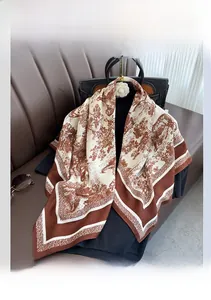 Detail of elegant large silk scarf with vintage Toile de Jouy pattern and brown borders