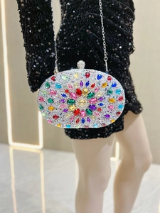 Macro view of crystal flower evening clutch bag with colorful gems and silver rhinestones