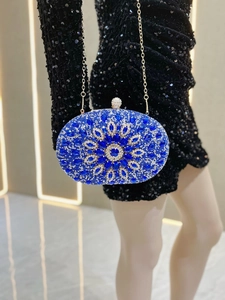 Macro detail of royal blue and silver rhinestones on a vintage oval evening clutch bag