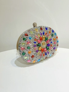 Macro view of luxurious floral pattern evening clutch with colorful sparkling rhinestones
