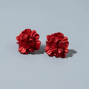 Detailed view of dark red 3D floral stud earrings with premium matte enamel texture