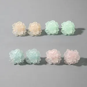 Detailed macro view of 2.5cm colorful 3D resin flower studs with glitter finish