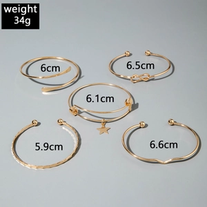 Detailed view of 5-piece gold bangle set with size annotations and infinity star charms