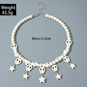 Detail of beaded necklace with skull charms and star pendant, 40cm length with 5.5cm chain