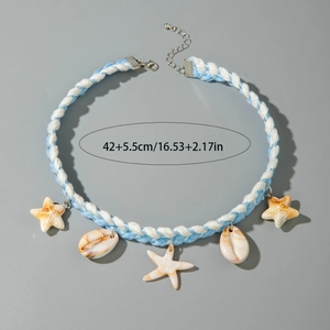 Detail of bohemian braided beach necklace featuring starfish charms and natural seashells