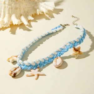 Detail of woven beach choker with natural shells, starfish charms and lobster clasp