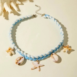 Detail of blue and white woven ocean necklace featuring starfish and shell charms