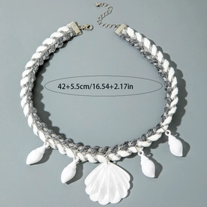 Detail of woven bohemian necklace with sea shells, starfish pendants and lobster clasp