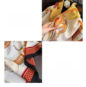 Detailed view of horse motif printed silk scarf featuring machine-rolled edges and texture