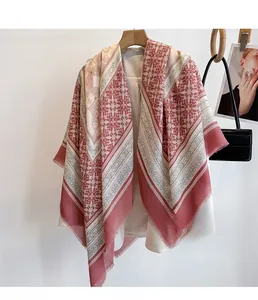 Close-up of ethnic geometric floral print scarf with delicate fringe tassels