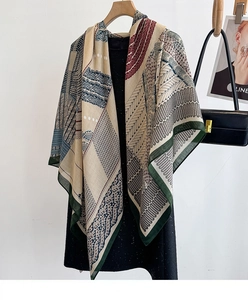 Close-up of the vintage geometric print and soft texture on the large scarf shawl