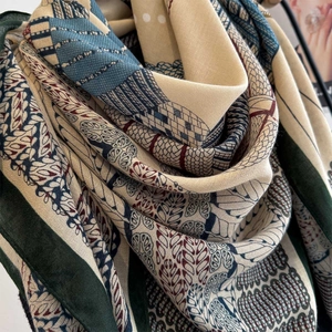 Detailed view of the elegant vintage floral print on a soft linen-touch square scarf