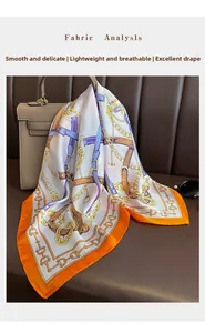 Foulard en soie avec motif chaîne équestre élégamment noué à un sac à main en cuir