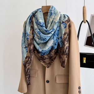 Floral and leopard print oversized shawl scarf styled on a blazer with a handbag