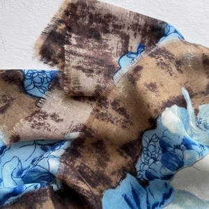 Floral print cotton linen scarf with frayed edges for sun protection and travel wear