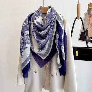 Blue and white French Toile de Jouy floral large square scarf draped on a blazer